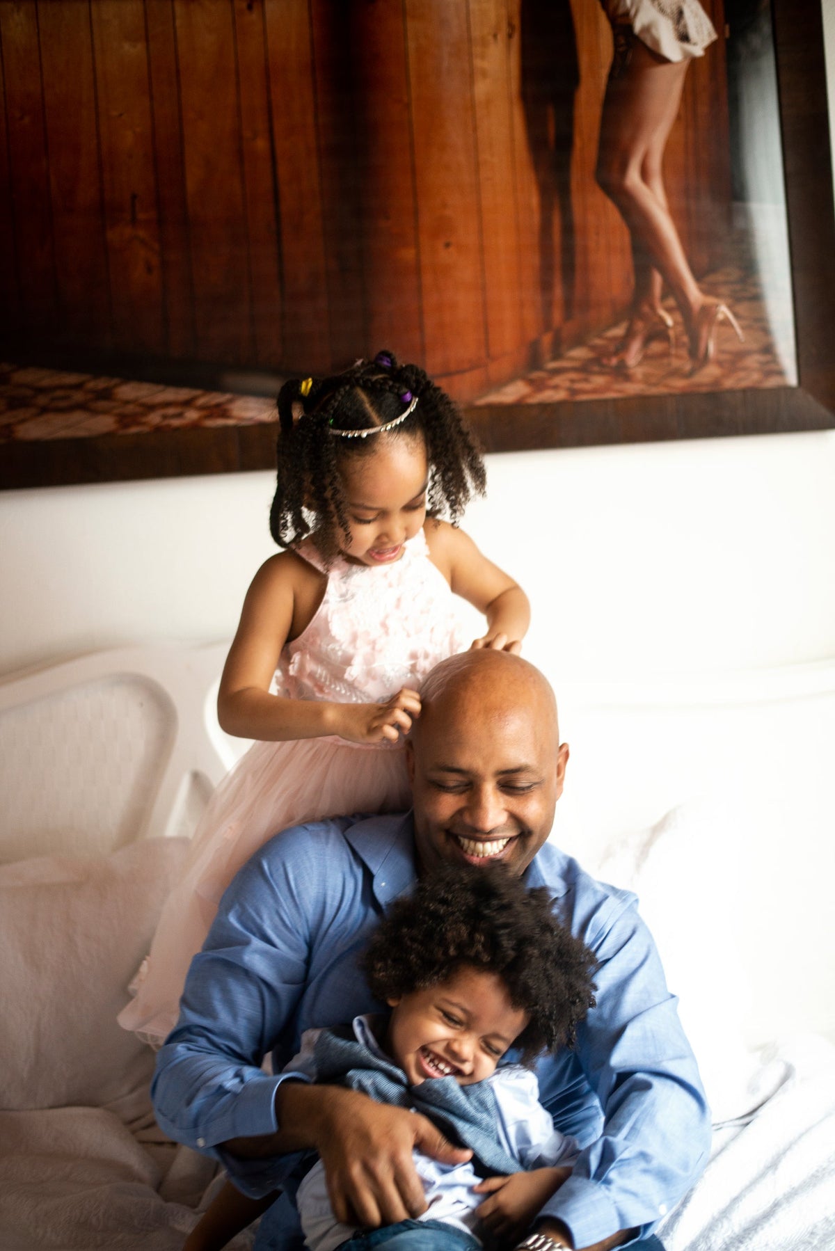 A father laughing with his children